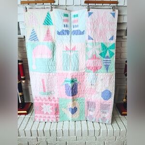 Festive Pastel Quilt with Geometric Patterns